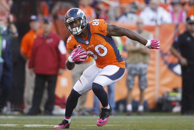Oct 5, 2014; Denver, CO, USA; Denver Broncos wide receiver Demaryius Thomas (88) runs with the ball after catching a pass during the first half against the Arizona Cardinals at Sports Authority Field at Mile High. The Broncos won 41-20.  Mandatory Credit: Chris Humphreys-USA TODAY Sports
