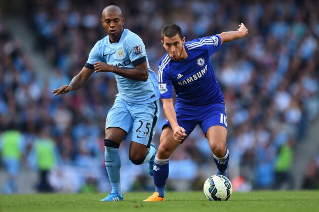 MANCHESTER, ENGLAND - SEPTEMBER 21:  Eden Hazard of Chelsea competes with Fernandinho of Manchester City during the Barclays Premier League match between Manchester City and Chelsea at the Etihad Stadium on September 21, 2014 in Manchester, England.  (Photo by Shaun Botterill/Getty Images)