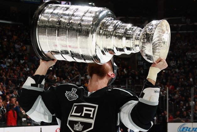 LOS ANGELES, CA - JUNE 13:  Jeff Carter #77 of the Los Angeles Kings kisses the Stanley Cup after his team won the game 3-2 in double overtime over the New York Rangers in Game Five of the 2014 Stanley Cup Final at the Staples Center on June 13, 2014 in Los Angeles, California. The Kings won the game 3-2 and win the series 4-1.  (Photo by Dave Sandford/NHLI via Getty Images)