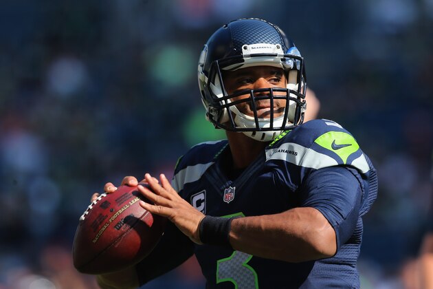 SEATTLE, WA - SEPTEMBER 21:  Quarterback Russell Wilson #3 of the Seattle Seahawks drops back to pass prior to the start of the game against the Denver Broncos at CenturyLink Field on September 21, 2014 in Seattle, Washington.  (Photo by Jeff Gross/Getty Images)