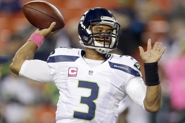 Seattle Seahawks quarterback Russell Wilson (3) warms up before an NFL football game against the Washington Redskins in Landover, Md., Monday, Oct. 6, 2014. (AP Photo/Patrick Semansky)