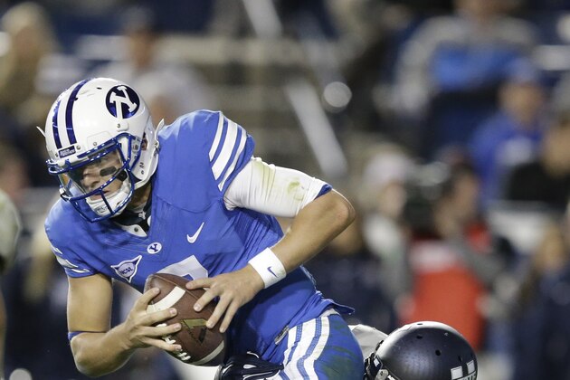 Utah State linebacker Torrey Green (39) sacks Brigham Young quarterback Christian Stewart (7) in the fourth quarter during an NCAA college football game Friday, Oct. 3, 2014, in Provo, Utah. Utah State won 35-20.  (AP Photo/Rick Bowmer)