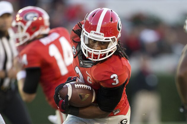 Georgia running back Todd Gurley (3) breaks through the Vanderbilt  line in the second  half of an NCAA college football game Saturday, Oct. 4, 2014, in Athens, Ga.. Georgia won 44-17. (AP Photo/John Bazemore)