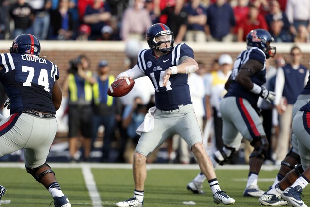 Mississippi quarterback Bo Wallace (14) sets up to pass against Alabama in the second half of an NCAA college football game in Oxford, Miss., Saturday, Oct. 4, 2014. No. 11 Mississippi won 23-17. (AP Photo/Rogelio V. Solis)