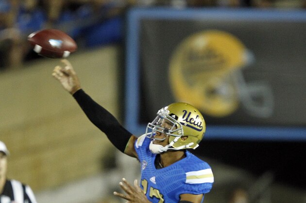 UCLA quarterback Brett Hundley (17) passes the ball against Utah during the first half of an NCAA college football game Saturday, Oct. 4, 2014, in Pasadena, Calif.  (AP Photo/Alex Gallardo)
