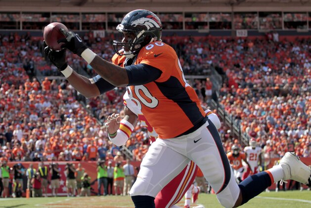 Denver Broncos tight end Julius Thomas (80) pulls in a touchdown pass against the Kansas City Chiefs during the first half of an NFL football game, Sunday, Sept. 14, 2014, in Denver. (AP Photo/Joe Mahoney)