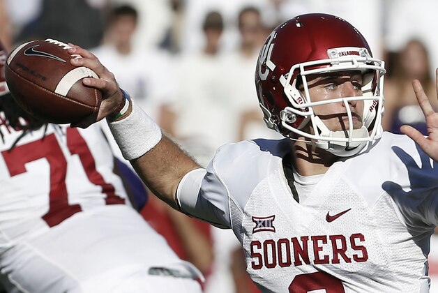 Oklahoma quarterback Trevor Knight (9) throws to an open teammate during the second half of a NCAA college football game against TCU at Amon G. Carter Stadium, Saturday, Oct. 4, 2014, in Fort Worth, Texas. TCU won 37-33. (AP Photo/Brandon Wade)