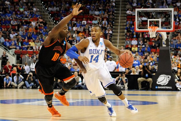 RALEIGH, NC - MARCH 21:  Rasheed Sulaimon #14 of the Duke Blue Devils drives to the basket against Ike Nwamu #10 of the Mercer Bears in the first half in the second round of the 2014 NCAA Men's Basketball Tournament at PNC Arena on March 21, 2014 in Raleigh, North Carolina.  (Photo by Grant Halverson/Getty Images)
