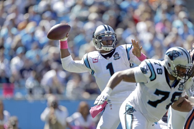 Carolina Panthers' Cam Newton (1) looks for an open receiver against the Chicago Bears during the first half of an NFL football game in Charlotte, N.C., Sunday, Oct. 5, 2014. The Panthers won 31-24. (AP Photo/Bob Leverone)