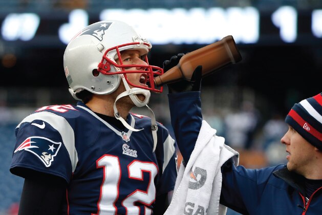 New England Patriots quarterback Tom Brady takes a drink before an NFL football game against the Cleveland Browns Sunday, Dec. 8, 2013, in Foxborough, Mass. (AP Photo/Elise Amendola)