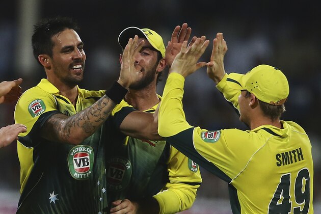 SHARJAH, UNITED ARAB EMIRATES - OCTOBER 07:  Mitchell Johnson of Australia celebrates with teammates after dismissing Asad Shafiq of Pakistan  during the first match of the one day international series between Australia and Pakistan at Sharjah Cricket Stadium on October 7, 2014 in Sharjah, United Arab Emirates.  (Photo by Francois Nel/Getty Images)