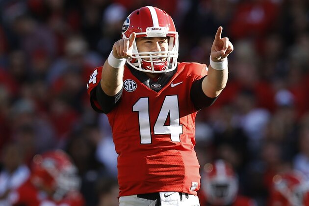 ATHENS, GA - OCTOBER 04:  Quarterback Hutson Mason #14 of the Georgia Bulldogs points out the defensive scheme during the game against the Vanderbilt Commodores at Sanford Stadium on October 4, 2014 in Athens, Georgia.  (Photo by Mike Zarrilli/Getty Images)