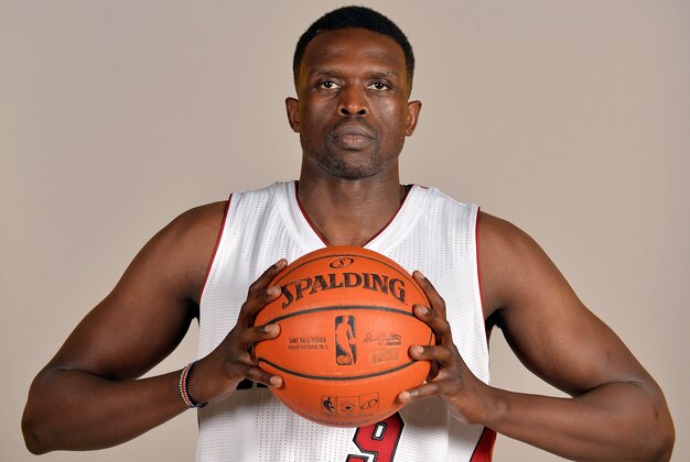 Sep 26, 2014; Miami, FL, USA;Miami Heat forward Luol Deng (9) poses during photo day at American Airlines Arena. Mandatory Credit: Steve Mitchell-USA TODAY Sports