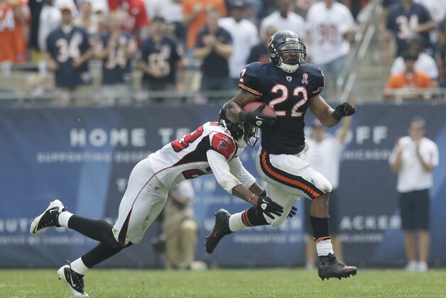 Chicago Bears running back Matt Forte (22) is tackled after a gain by Atlanta Falcons safety Thomas DeCoud (28)  in the second half of an NFL football game in Chicago, Sunday, Sept. 11, 2011. (AP Photo/Nam Y. Huh)
