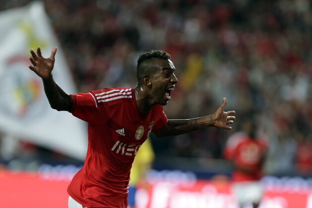 Benfica's Anderson Talisca, from Brazil, celebrates after scoring the opening goal against Arouca during the Portuguese league soccer match between Benfica and Arouca at Benfica's Luz stadium in Lisbon, Sunday, Oct. 5, 2014. (AP Photo/Francisco Seco)