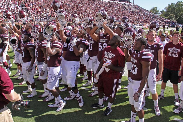 The Mississippi State team celebrates their 48-31 win over Texas A&M by singing the MSU Alma Mater at Davis Wade Stadium after their NCAA college football game in Starkville, Miss., Saturday, Oct. 4, 2014. (AP Photo/Jim Lytle)