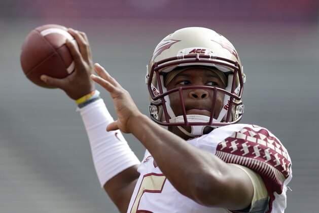 Florida State's quarterback Jameis Winston warms up prior to an NCAA college football game against North Carolina State in Raleigh, N.C., Saturday, Sept. 27, 2014. (AP Photo/Gerry Broome)