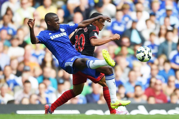 Chelsea’s Ramires, left, competes for the ball with Swansea City’s Jefferson Montero during their English Premier League soccer match at Stamford Bridge, London, Saturday, Sept. 13, 2014. (AP Photo/Tim Ireland)