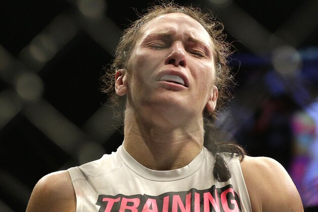 Cat Zingano reacts after defeating Amanda Nunes in their women’s bantamweight mixed martial arts bout at UFC 178 on Saturday, Sept. 27, 2014, in Las Vegas. (AP Photo/John Locher)