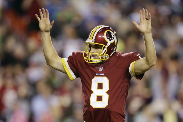 Washington Redskins quarterback Kirk Cousins (8) reacts to wide receiver Andre Roberts' touchdown during the second half of an NFL football game against the Seattle Seahawks in Landover, Md., Monday, Oct. 6, 2014. (AP Photo/Patrick Semansky)