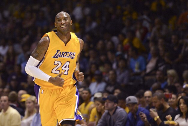 Oct 6, 2014; San Diego, CA, USA; Los Angeles Lakers guard Kobe Bryant (24) laughs after being called for traveling during the first half against the Denver Nuggets at Valley View Casino Center. Mandatory Credit: Jake Roth-USA TODAY Sports