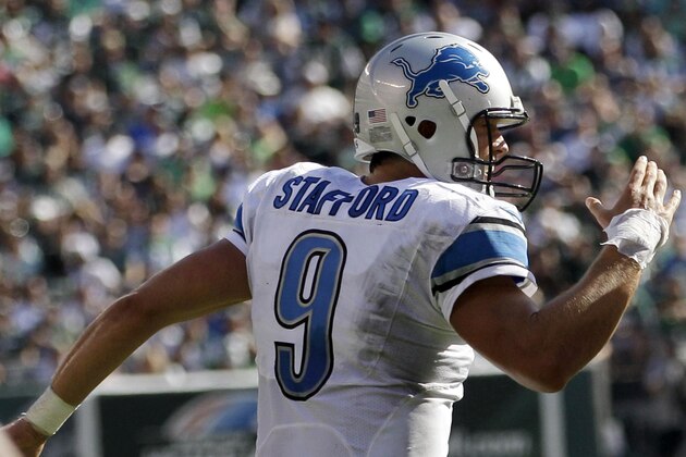 Detroit Lions quarterback Matthew Stafford celebrates after scoring a touchdown run against the New York Jets during the second half of an NFL football game, Sunday, Sept. 28, 2014, in East Rutherford, N.J. (AP Photo/Frank Franklin II)
