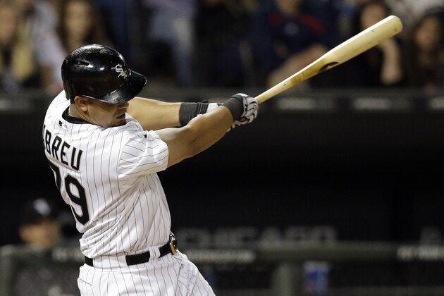 Chicago White Sox's Jose Abreu hits a two-run home run during the first inning of a baseball game against the Kansas City Royals in Chicago on Saturday, Sept. 27, 2014. (AP Photo/Nam Y. Huh)
