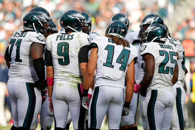 Philadelphia Eagles' Nick Foles huddles during the second half of an NFL football game against the St. Louis Rams, Sunday, Oct. 5, 2014, in Philadelphia. (AP Photo/Michael Perez)
