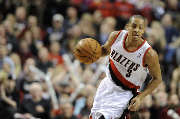 The Portland Trail Blazers' CJ McCollum (3) drives against the Orlando Magic during an NBA basketball game in Portland, Ore., Wednesday Jan. 8, 2014. (AP Photo/Greg Wahl-Stephens)