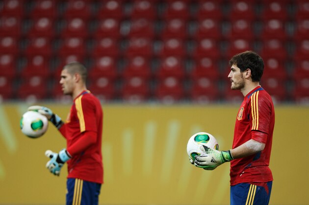 RECIFE, BRAZIL - JUNE 15:  Goalkeeper Iker Casillas (R) of Spain flanked by his teammate Victor Valdes  during a training session, ahead of their FIFA Confederations Cup Brazil 2013 opening game against Uruguay, at the Pernambuco Stadium on June 15, 2013 in Recife, Brazil.  (Photo by Jasper Juinen/Getty Images)