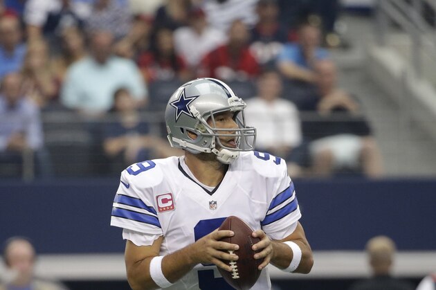 Dallas Cowboys' Tony Romo (9) drops back to pass against the Houston Texans in an NFL football game, Sunday, Oct. 5, 2014, in Arlington, Texas. (AP Photo/Tim Sharp)