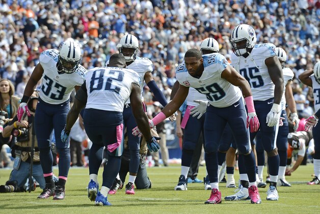 Tennessee Titans tight end Delanie Walker (82) is introduced before an NFL football game against the Cleveland Browns Sunday, Oct. 5, 2014, in Nashville, Tenn. (AP Photo/Mark Zaleski)