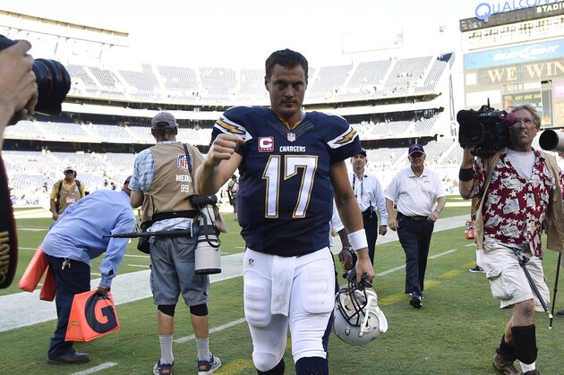 San Diego Chargers quarterback Philip Rivers (17) pumps his fist after the Chargers beat the New York Jets 31-0 in an NFL football game Sunday, Oct. 5, 2014, in San Diego.  (AP Photo/Denis Poroy)