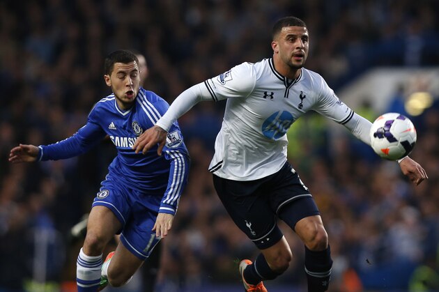 Chelsea's Eden Hazard, left, competes with Tottenham Hotspur's Kyle Walker during their English Premier League soccer match at Stamford Bridge, London, Saturday, March 8, 2014. (AP Photo/Sang Tan)