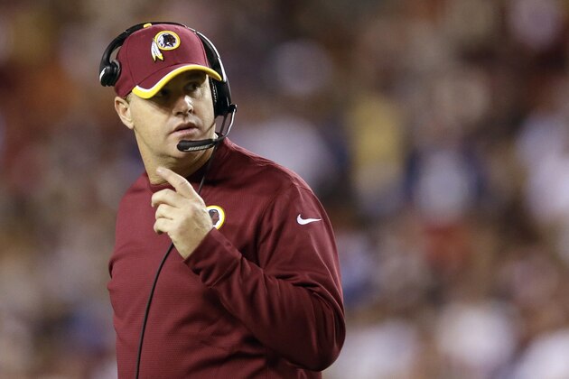 Washington Redskins head coach Jay Gruden looks over his shoulder during the first half of an NFL Thursday night football game against the New York Giants in Landover, Md., Thursday, Sept. 25, 2014. (AP Photo/Patrick Semansky)