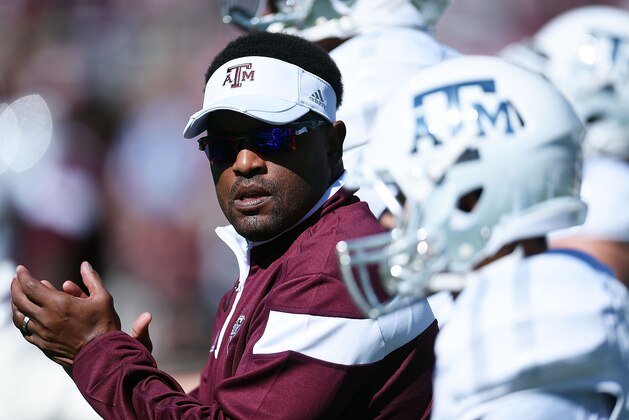 STARKVILLE, MS - OCTOBER 04:  Head coach Kevin Sumlin of the Texas A&M Aggies leads his team onto the field prior to a game against the Mississippi State Bulldogs at Davis Wade Stadium on October 4, 2014 in Starkville, Mississippi.  (Photo by Stacy Revere/Getty Images)