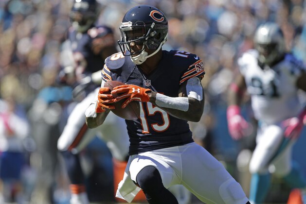 Chicago Bears' Brandon Marshall (15) runs after a catch against the Carolina Panthers during the first half of an NFL football game in Charlotte, N.C., Sunday, Oct. 5, 2014. (AP Photo/Bob Leverone)
