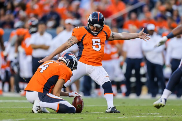 DENVER, CO - AUGUST 23:  Kicker Matt Prater #5 of the Denver Broncos kicks a 32 yard field goal as Britton Colquitt #4 holds the ball against the Houston Texans in the first quarter during a preseason game at Sports Authority Field at Mile High on August 23, 2014 in Denver, Colorado.  (Photo by Justin Edmonds/Getty Images)