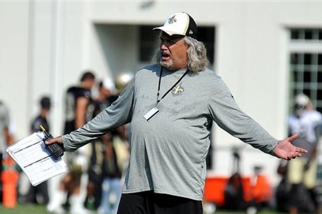 FILE - In this Aug. 5, 2014, file photo, New Orleans Saints defensive coordinator Rob Ryan gestures during the teams NFL football training camp in White Sulphur Springs, W.Va. One season after orchestrating a turnaround as the Saints' defensive coordinator, Ryan has an upgraded roster. (AP Photo/Chris Tilley, File)