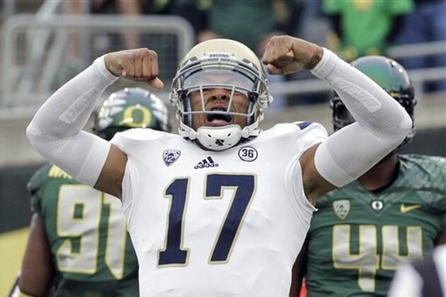 UCLA quarterback Brett Hundley reacts after scoring a touchdown during the first half of an NCAA college football game against Oregon  in Eugene, Ore., Saturday, Oct. 26, 2013. (AP Photo/Don Ryan)