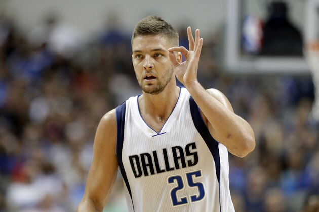 Dallas Mavericks forward Chandler Parsons (25) celebrates after hitting a three-point basket in the first half of a preseason NBA basketball game against the Houston Rockets, Tuesday, Oct. 7, 2014, in Dallas. (AP Photo/Tony Gutierrez)