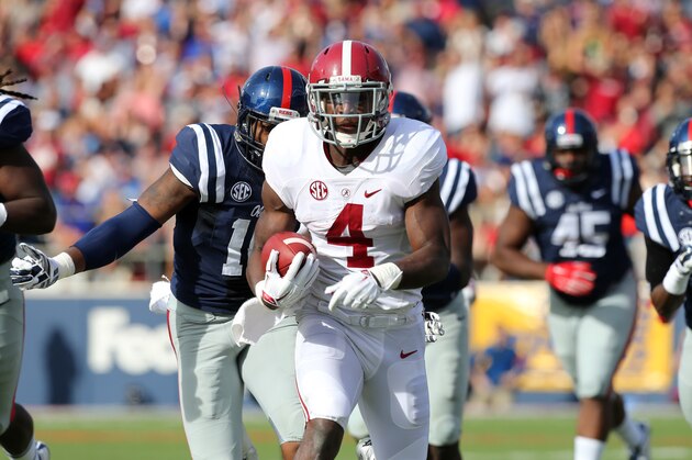 OXFORD, MS - OCTOBER 4: T.J. Yeldon #4 of the Alabama Crimson Tide runs against the Ole Miss Rebels on October 4, 2014 at Vaught-Hemingway Stadium in Oxford, Mississippi.  (Photo by Joe Murphy/Getty Images)