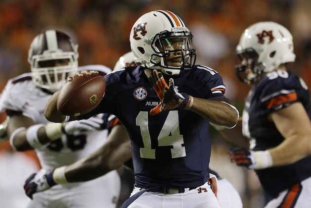 Auburn quarterback Nick Marshall (14) looks for a receiver in the second half of an NCAA college football game in Auburn, Ala., Saturday, Sept. 14, 2013. Auburn beat Mississippi State 24-20. (AP Photo/Dave Martin)