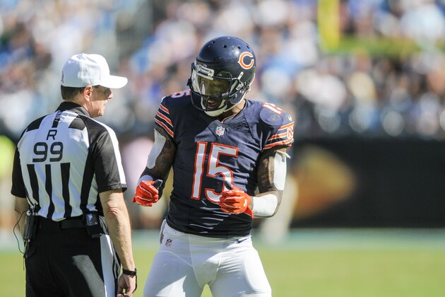 Chicago Bears wide receiver Brandon Marshall (15) talkd with referee Tony Corrente (99) during the second half of an NFL football game between the Carolina Panthers and the Chicago Bears in Charlotte, NC, Sunday, Oct. 5, 2014. (AP Photo/Mike McCarn)
