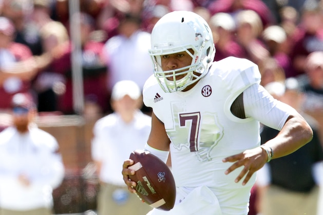 Oct 4, 2014; Starkville, MS, USA; Texas A&M Aggies quarterback Kenny Hill (7) carries the ball against the Mississippi State Bulldogs at Davis Wade Stadium. Mandatory Credit: Marvin Gentry-USA TODAY Sports
