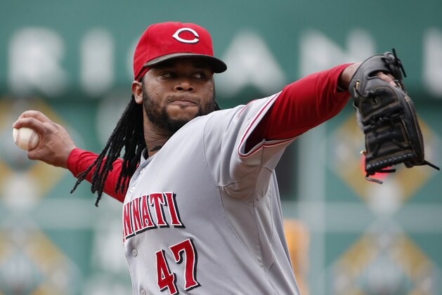 Cincinnati Reds starting pitcher Johnny Cueto warms up before the third inning of a baseball game against the Pittsburgh Pirates in Pittsburgh Sunday, Aug. 31, 2014. (AP Photo/Gene J. Puskar)