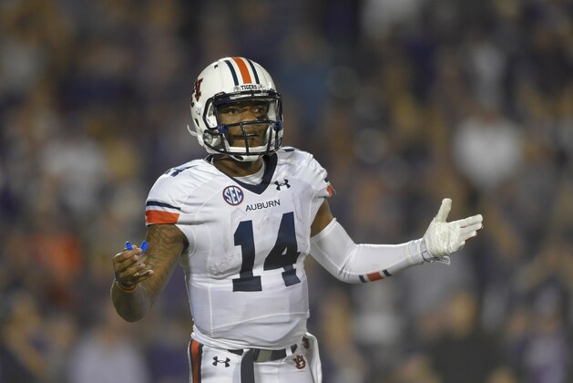 Auburn Tigers quarterback Nick Marshall (14) looks to the sideline for directions against Kansas State during an NCAA college football game Thursday, Sept. 18, 2014 in Manhattan, Kan. (AP Photo/Reed Hoffmann)