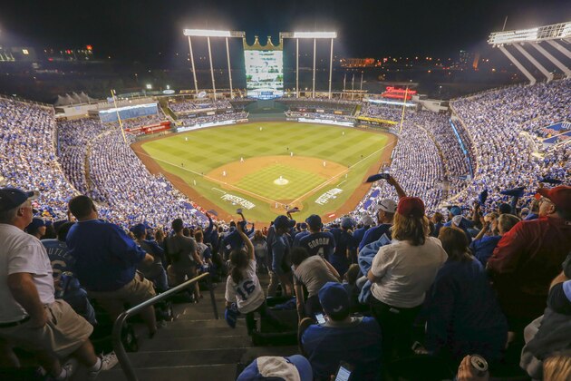 Fans cheer during the third inning of Game 3 of baseball's AL Division Series between the Kansas City Royals and the Los Angeles Angels in Kansas City, Mo., Sunday, Oct. 5, 2014. (AP Photo/Orlin Wagner)