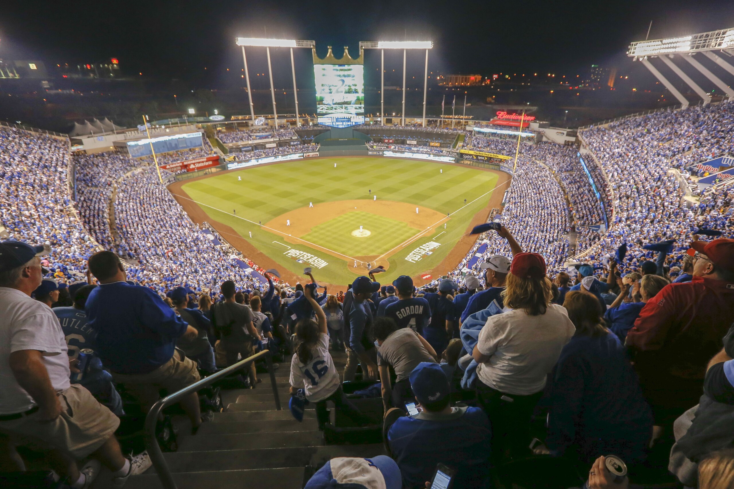 Fans cheer during the third inning of Game 3 of baseball's AL Division Series between the Kansas City Royals and the Los Angeles Angels in Kansas City, Mo., Sunday, Oct. 5, 2014. (AP Photo/Orlin Wagner)