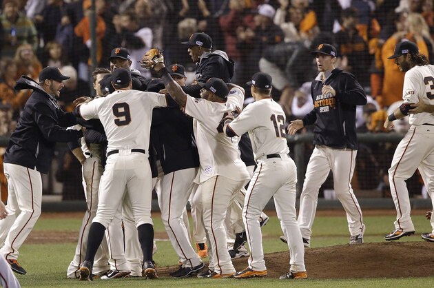 San Francisco Giants players celebrate after beating the Washington Nationals in Game 4 of baseball's NL Division Series in San Francisco, Tuesday, Oct. 7, 2014. The Giants won 3-2 to win the series. (AP Photo/Jeff Chiu)